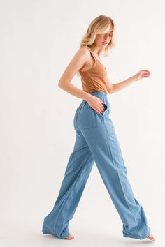 Feeling Alive chambray pants help you breeze through the day in comfort and style. Crafted from lightweight denim that's stone washed for a relaxed look, these front-pocket pants have an elastic waist and no back pockets for an easy fit. The front seam detail adds just enough visual interest, so you look put together without sacrificing comfort. Pair these easy pants with sneakers for the perfect stay-at-home-but-get-things-done outfit. 95% Cotton, 5% Polyester Want to view this on the *Live* Si Relaxed Summer Jeans For Everyday, Versatile Denim Blue Bottoms For Everyday, Light Wash Wide Leg Pull-on Bottoms, Medium Wash Cargo Jeans For Everyday In Spring, Everyday Medium Wash Cargo Jeans For Spring, Relaxed High Rise Jeans With Pockets, Everyday Spring High Rise Cargo Jeans, Relaxed High-rise Jeans With Pockets, Everyday High Rise Cargo Jeans For Spring