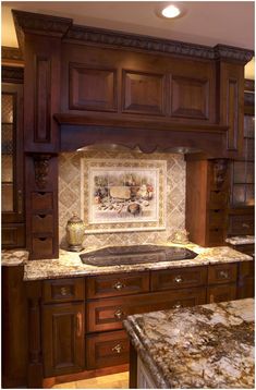 a kitchen with marble counter tops and wooden cabinets