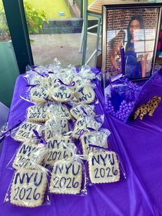 purple table with cookies and pictures on it