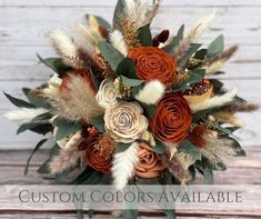 a bridal bouquet with feathers and flowers