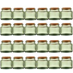 six glass jars with cork lids are lined up