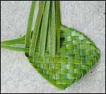 a green piece of cloth sitting on the ground