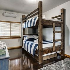 a bunk bed sitting in the middle of a bedroom