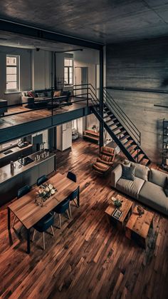 a living room filled with furniture next to a wooden floor covered in lots of windows