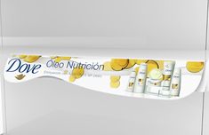 a white shelf with some yellow and white items on it's sides, along with the words dove deo nutrition