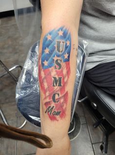 a person with a patriotic tattoo on their arm