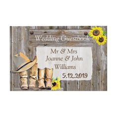 a wedding guest book with cowboy boots and sunflowers