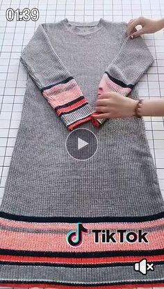 someone is making a t - shirt out of knitted material