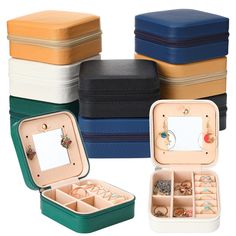 several different colored jewelry boxes with rings in them