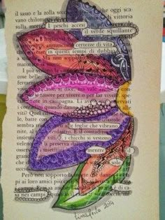 an art piece with words written in different colors and shapes on the bottom half of it