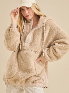 This oversized sherpa pullover offers ultimate comfort and warmth with its plush sherpa fabric and drawstring hood. Multiple pockets provide convenient storage, making it the perfect companion for chilly days and outdoor adventures. Sherpa Fabric, Sherpa Pullover, Altar'd State, Christmas Dress, Christmas Sweatshirts, Outdoor Adventures, Crochet Clothes, Outdoors Adventure, Vest Jacket