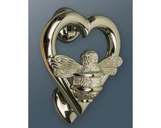 a heart shaped brooch with two wings