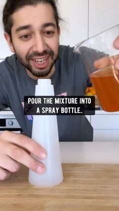 a man pouring liquid into a bottle with the caption pour the mixture into a spray bottle