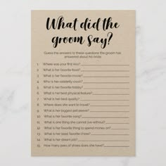 what did the groom say? card with question mark on it in black ink against a white marble background