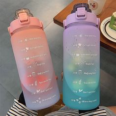 two water bottles sitting next to each other