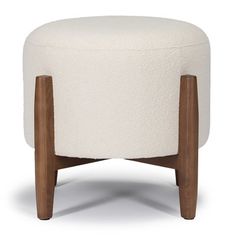 a white ottoman with wooden legs on an isolated background, in the shape of a footstool