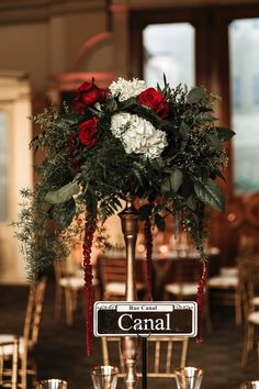 the centerpiece is adorned with flowers and greenery