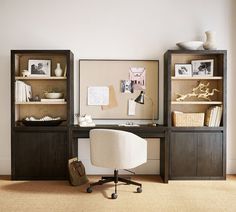 a chair and desk in front of a bookcase with pictures on the wall behind it