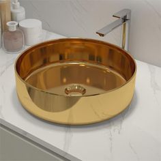 a bathroom sink that is gold in color