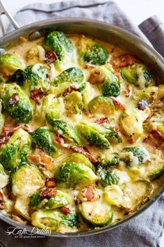 a casserole dish with brussel sprouts, bacon and cheese