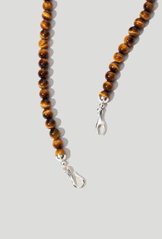 A statement heirloom brought up-to-date. Available in Black Onyx or Tiger's Eye. Sterling silver hand cast clasp Tiger's Eye Jewelry Care Instructions, A Perfect Circle, Lemon Quartz, Hand Cast, Quartz Earrings, Tiger's Eye, Necklace Sterling Silver, Tiger Eye, Black Onyx