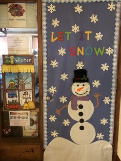 a bulletin board with a snowman on it and let it snow written on the front