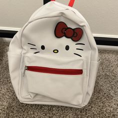 Mini Hello Kitty Backpack New. Large Backpack Also Available Kawaii White Backpack For Students, White Hello Kitty Print Bag For Daily Use, Kawaii White Backpack For Everyday Use, White Kawaii Backpack For Everyday Use, Cute White Standard Backpack, Trendy White Bag With Cat Design, White Hello Kitty Bag For Daily Use, White Hello Kitty Backpack For Everyday Use, Trendy White Hello Kitty Bag