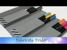 an assortment of colored pens and markers in a gray box with the words fabricate friday written on it