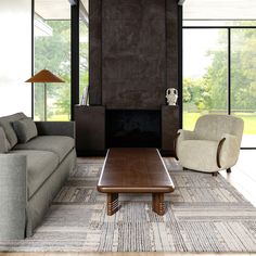 a living room with two couches and a coffee table in front of a fireplace