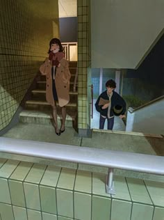 two people are walking up the stairs in an underground station, one is wearing a coat and the other is carrying a purse