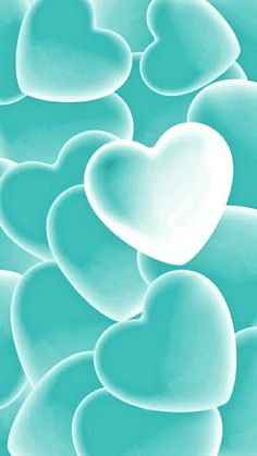 many heart shaped bubbles floating in the air with blue hues and light green colors