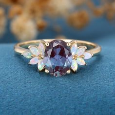 Oval cut Alexandrite | Opal Engagement ring Colour Stone Rings, Opal And Sapphire Ring, Opal Engagement Ring Rose Gold, Non Traditional Wedding Ring, Pretty Engagement Rings, Cute Engagement Rings, Opal Wedding Rings, Alexandrite Engagement Ring, Ring Inspo