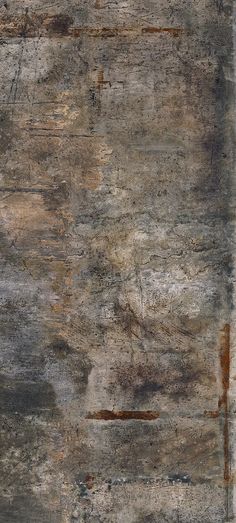 an old, grungy concrete wall with rusted paint