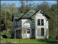 an old run down house in the woods