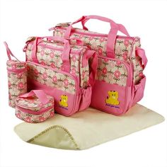 a set of pink and white bags with teddy bears on the front, along with matching purses