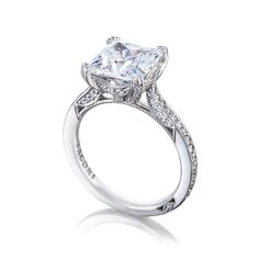 an engagement ring with a princess cut diamond in the center