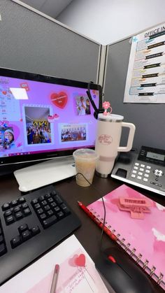 a desktop computer monitor sitting on top of a desk next to a keyboard and mouse