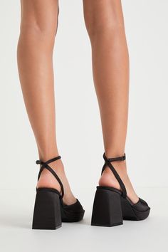 You'll have everyone head over heels for the way you style the Lulus Shirine Black Satin Platform Ankle Strap Heels! Sleek satin shapes these must-have heels with a square footbed and a wide toe strap with a low-cut collar, all atop a 1"" toe platform. Matching straps sprout from the sides to wrap around the ankle and secure with a chrome silver buckle. A chunky, sculpted block heel completes the adorable look! 3. 5" wrapped block heel. Cushioned insole. Felted rubber sole has nonskid markings. Spring Satin Heels With Pointed Toe, Satin Platform High Heels, Chic Satin Heels With Round Toe, Satin Heels For Night Out, Fitted Satin Open Toe Heels, High Heels With Padded Ankle For Evening, Satin Sandals With Wrapped Heel, Block Heels With Padded Ankle, Square Toe Synthetic Heels For Evening