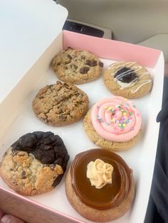 a box filled with lots of different types of cookies