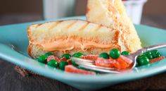 a piece of toasted bread with jelly beans on it and a fork next to it