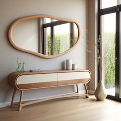 a wooden dresser sitting next to a large mirror on top of a window sill