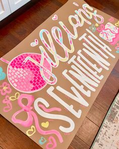 a welcome mat is on the floor in front of a door with flowers and hearts