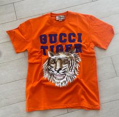 The t-shirt is in perfect condition. No signs of use, the neck is not stretched. No stains or scuffs. Slim Fit  Pit to pit 22 inches  Shoulder 20  inches  Length 30 INCHES For XL Pit-to-pit 23 INCHES  shoulder 21 INCHES  length 31 inches Gucci Tiger, Tiger Orange, Tiger T Shirt, Vintage Gucci, Tee Shirt, Ukraine, Gender Neutral, Bathing Beauties, Adult Outfits