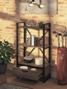 a book shelf sitting on top of a wooden floor next to a vase and potted plant