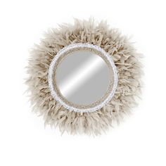 a mirror that has some kind of thing on top of it with feathers around it