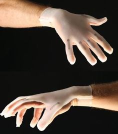 two hands with white gloves on each hand