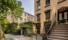 an apartment building with stairs leading up to it