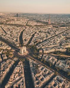 an aerial view of paris with the eiffel tower in the distance, taken from above