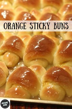 orange sticky buns in a baking pan with caramel glaze and text overlay