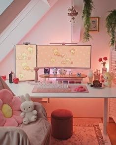 a desk with two computer monitors and a stuffed animal on the chair next to it